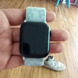 Smart Wearable with Black Display and Gray Strap